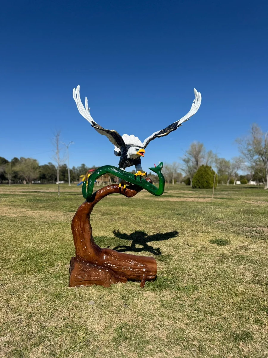 Eagle Fighting a Snake a Log.